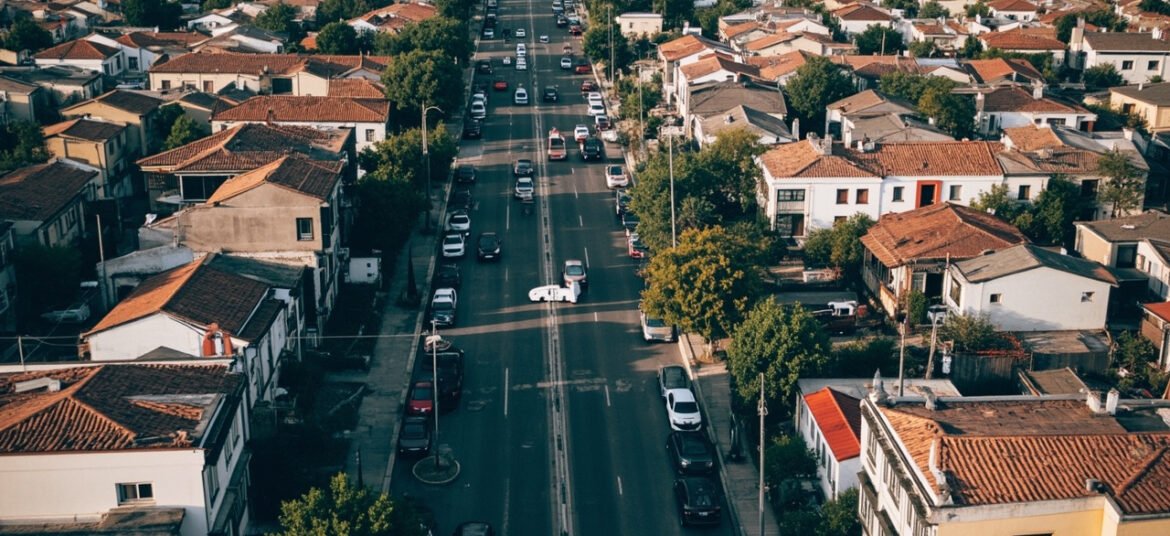 Calle de barrio con autos estacionados, el parque automotor de una zona